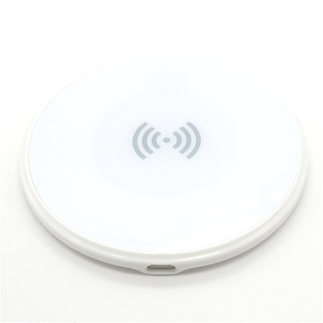 White round wireless charging pad viewed from above