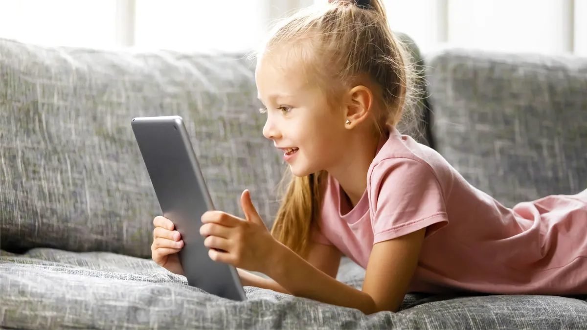 Child-friendly tablet on a table with a colorful case